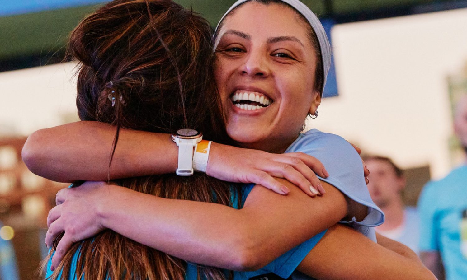 2026 JPMorganChase Corporate Challenge Joburg: two participants embracing after the race